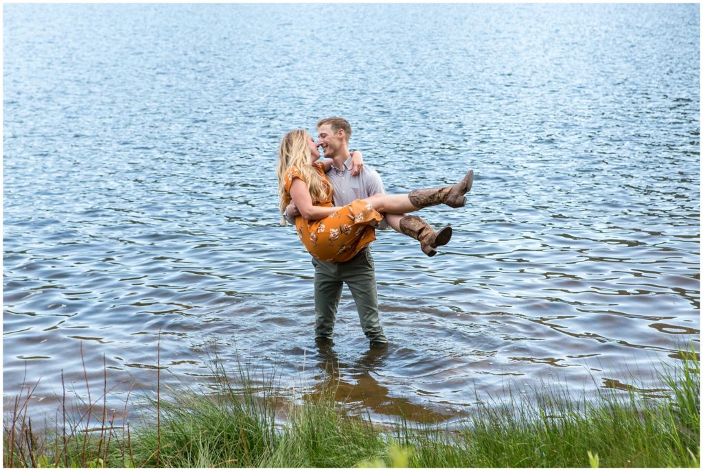 Trevor and Caitlyn jump in the water during their photography session in Rocky Mountain National Park Colorado