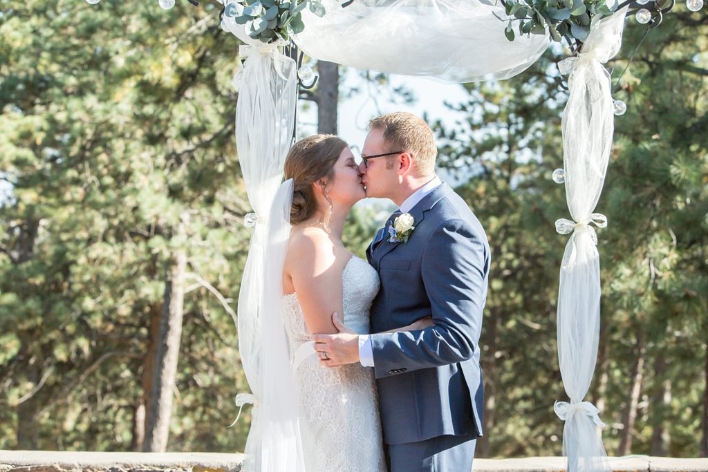 Ceremony kiss at Boettcher mansion with Courtney and Andy
