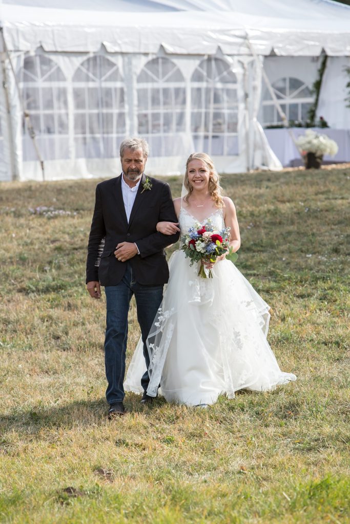 Walking down the aisle with bride and her dad