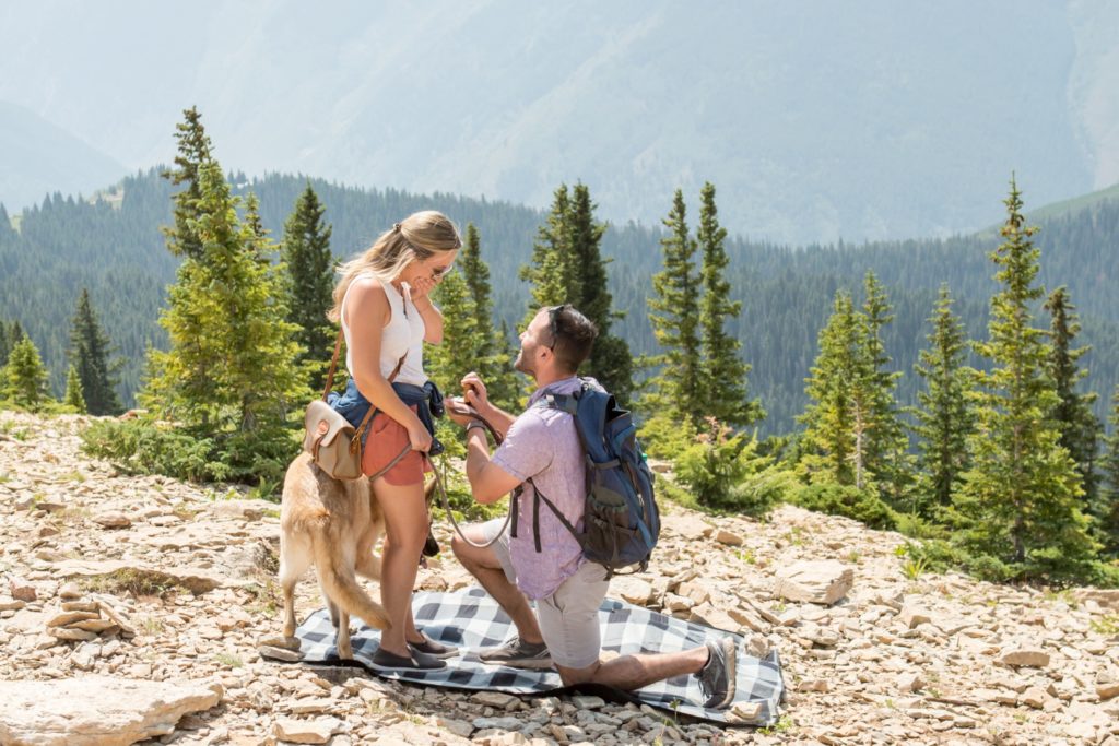 Colorado surprise proposal photographer on the top of a ski resort mountain