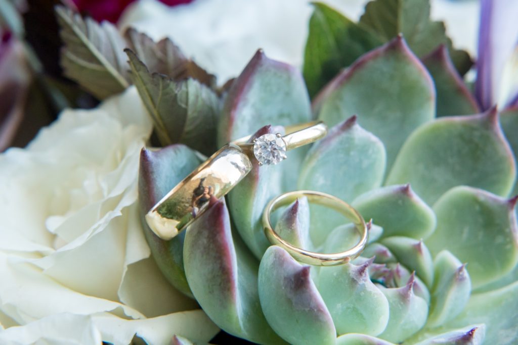 Colorado wedding rings with floral bouquet