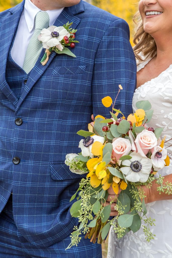 bride and groom detail blue suit