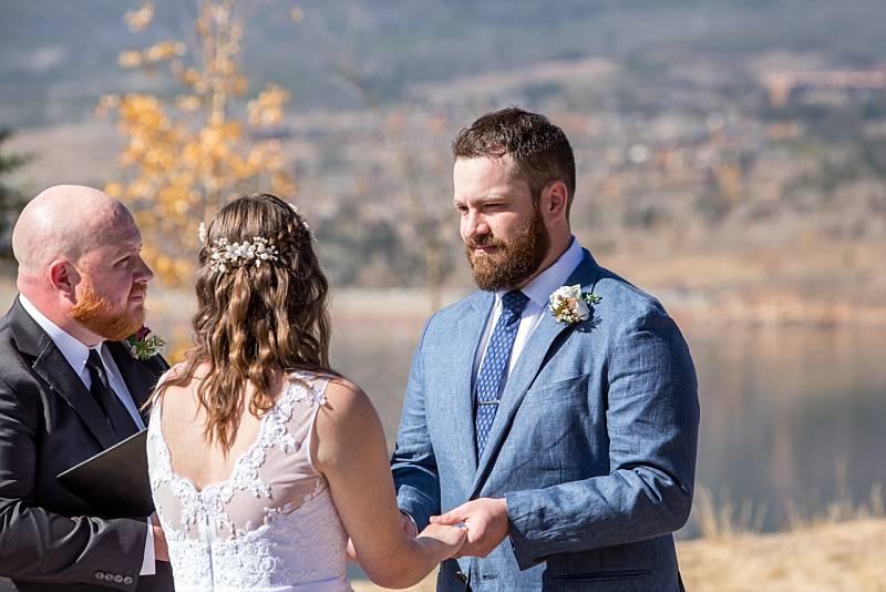Tanner's face during vows at ceremony at Lake Dillon