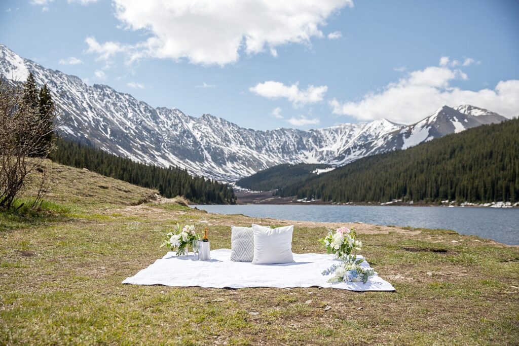Proposal setup with champagne and flowers at Clinton Gulch