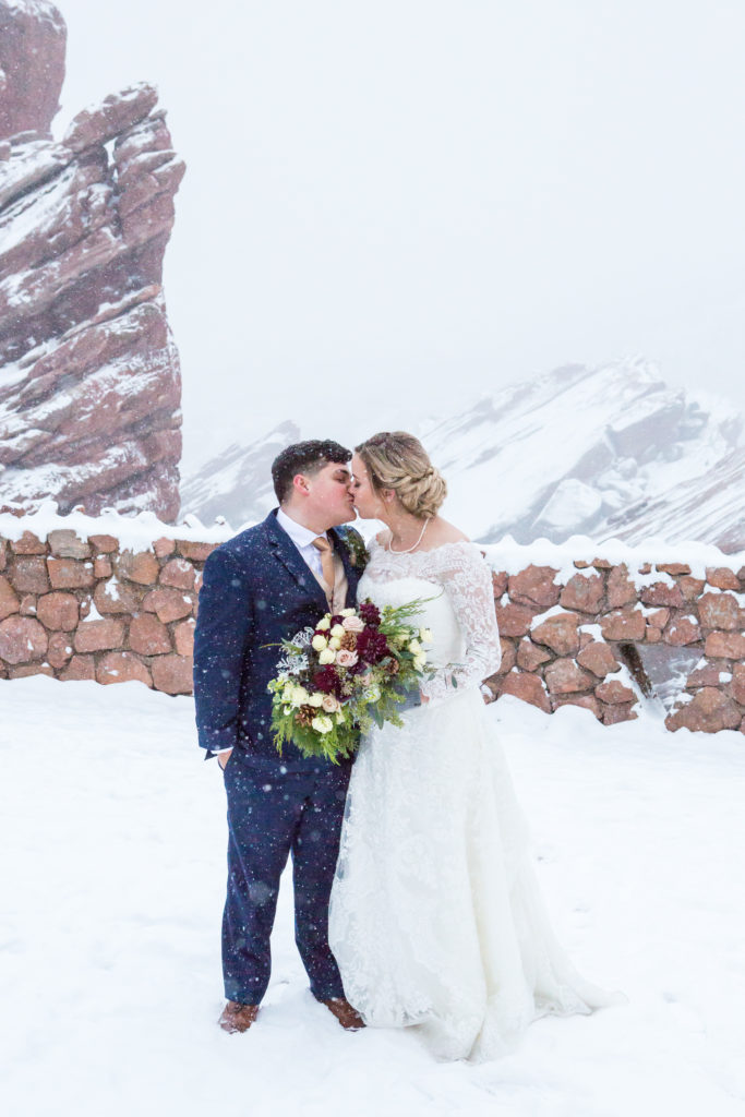 couple kissing portrait in the snow at Red Rocks Park - - Nichole Emerson Photography