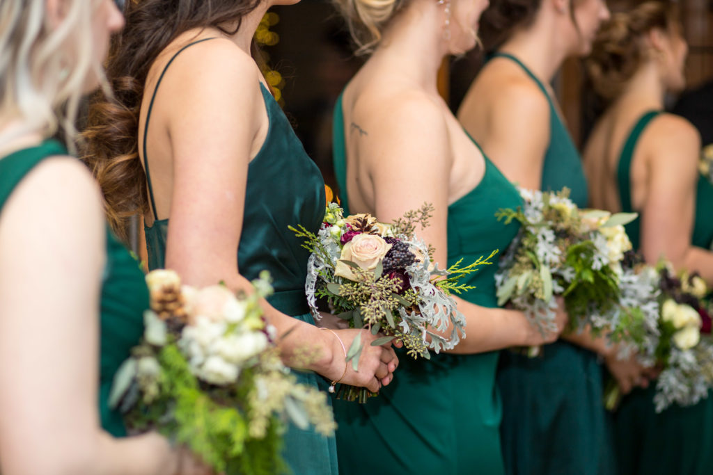 details shot of bridesmaids with flowers - - Nichole Emerson Photography
