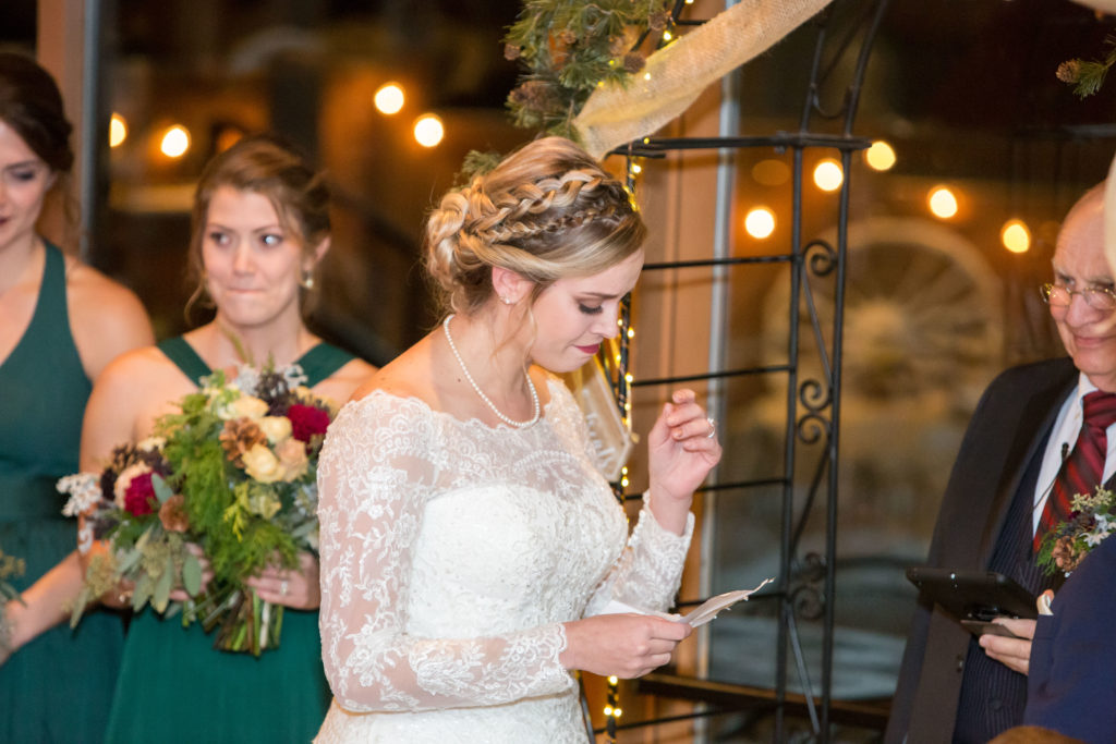 bride saying her vows during the ceremony - - Nichole Emerson Photography