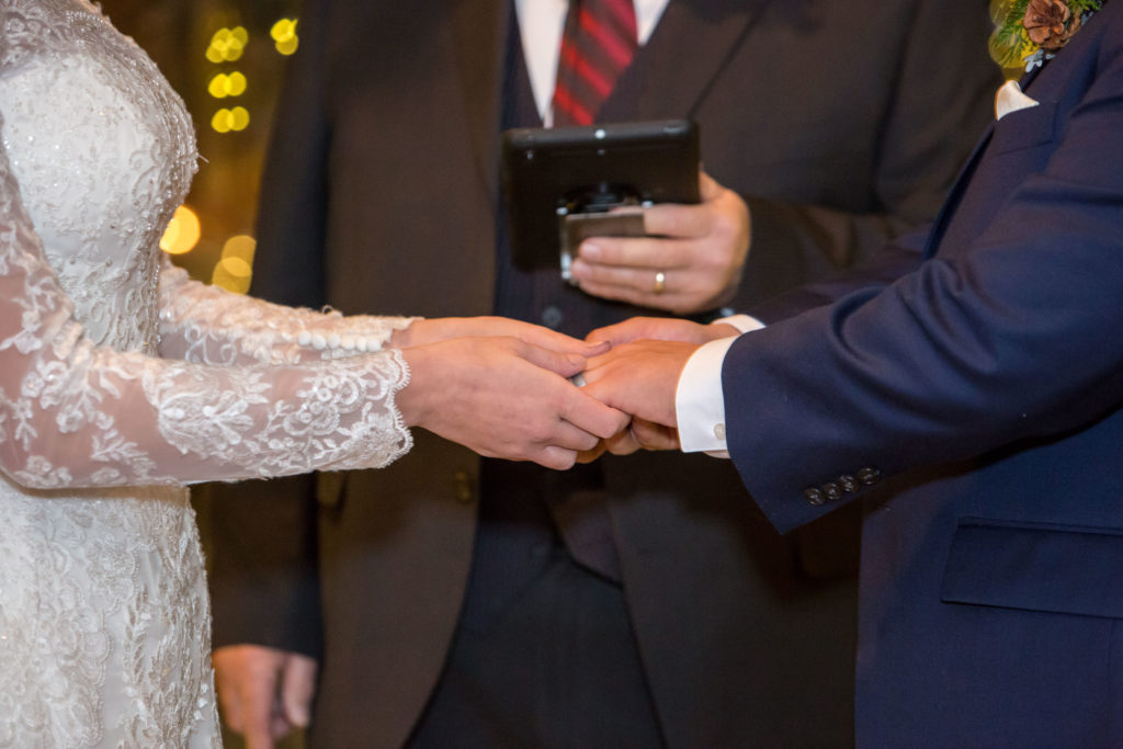 sharing rings during the ceremony - - Nichole Emerson Photography