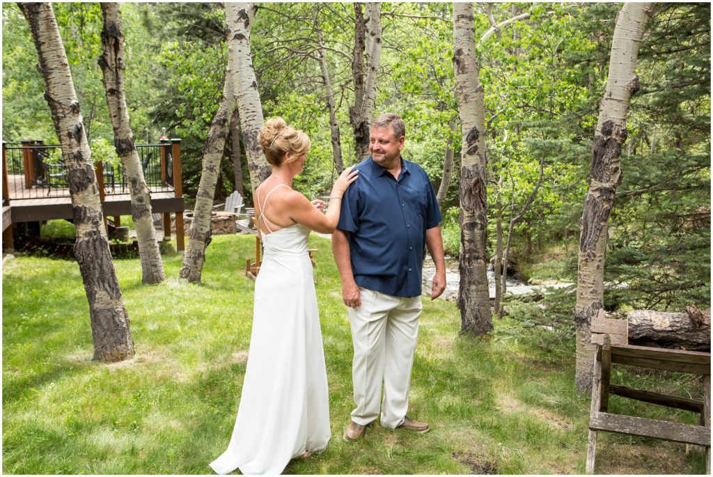 First look portrait at Jana and Mike's cabin wedding in Colorado.