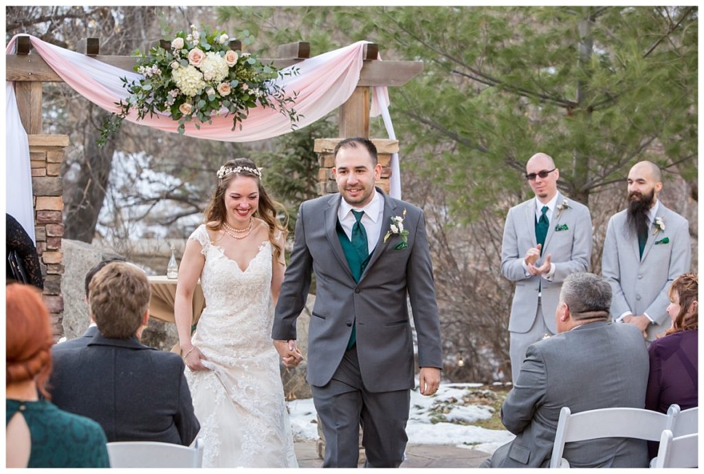 Hannah and Matt walk back down the aisle during their outdoor wedding ceremony in Boulder CO