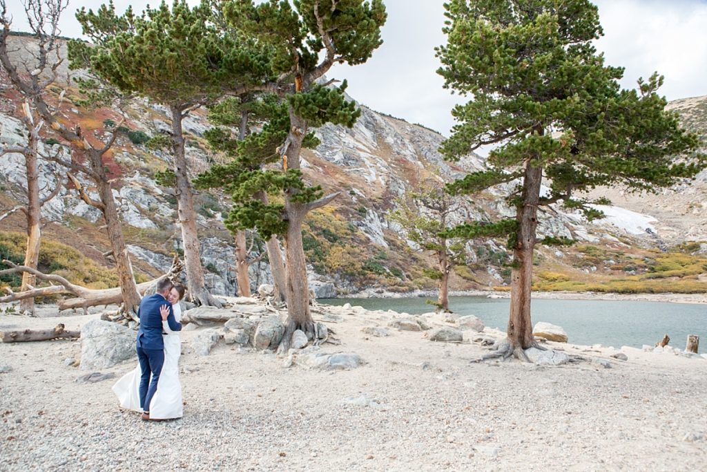 Dancing during their adventure elopement at St Mary's Glacier