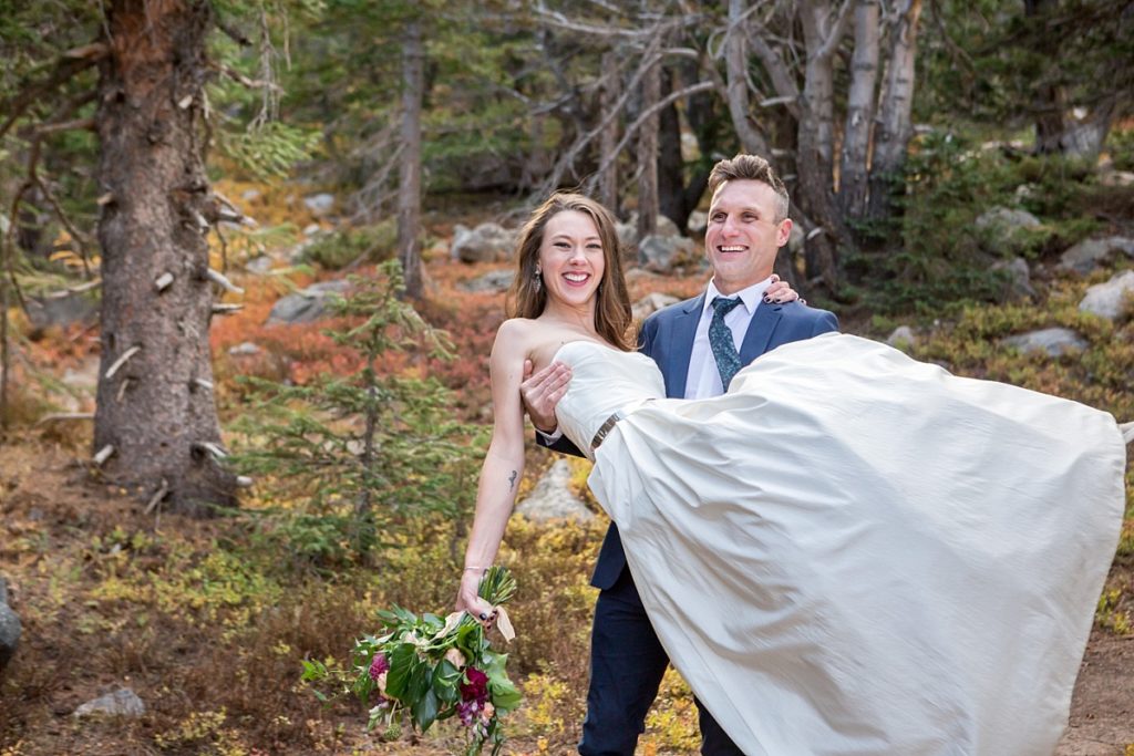 Adventure elopement photographer hiking at St Mary's Glacier