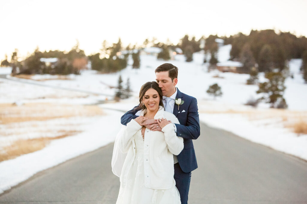 couple in snowy weather on their wedding day.