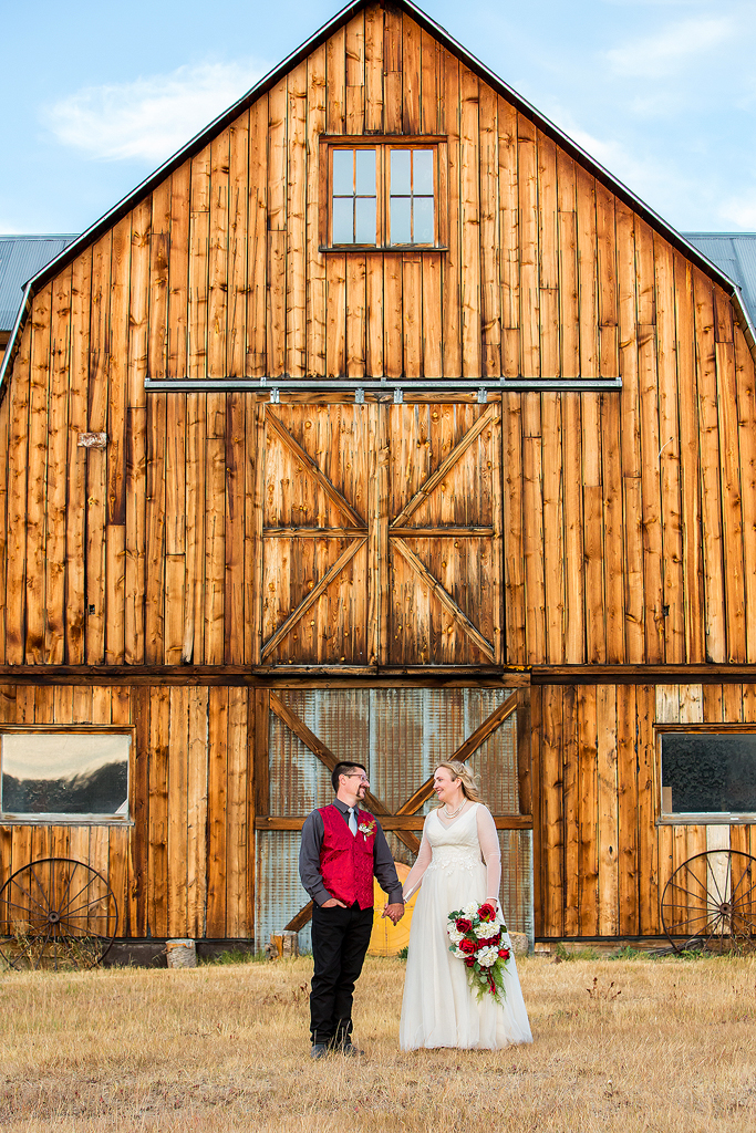 Couple in front of a barn in Steamboat Springs on their wedding.