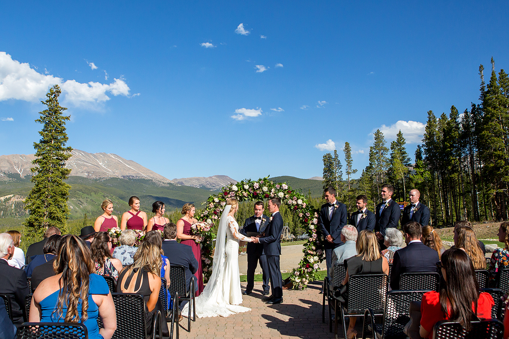 Courtney and Austin exchange vows during their wedding ceremony at Breckenridge Mountain in Colorado.