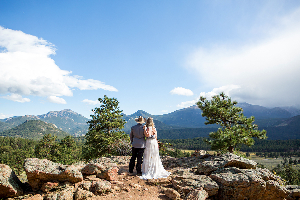 Tina and Nathan taking in the mountain view at 3M Curve, a Colorado Mountain wedding location