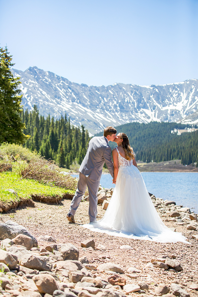 Madi and Chase kiss during their mountain elopement in Colorado