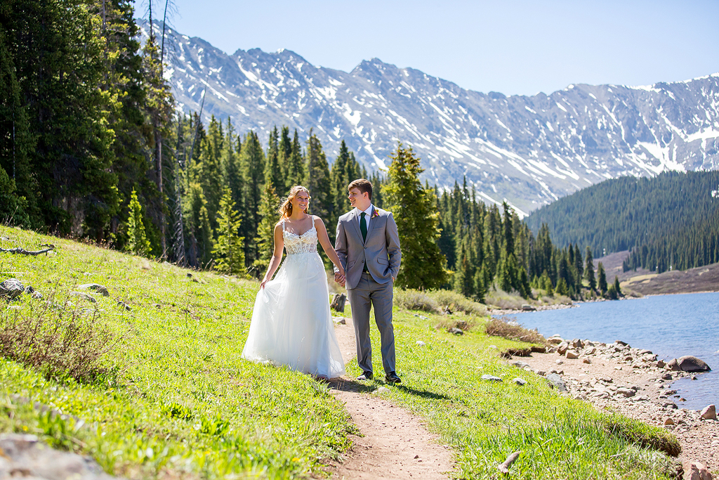 Madi and Chase walk along an alpine lake trail near Breckenridge, Colorado.