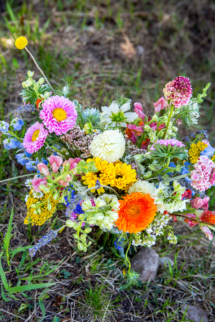 Close up of bridal bouquet in the grass.
