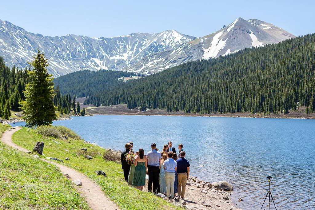 Wide view of Colorado elopement ceremony at an alpine lake near Breckenridge.