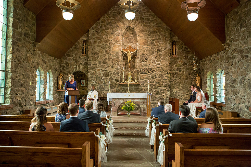 Wedding ceremony inside Camp St Malo in Allenspark, Colorado
