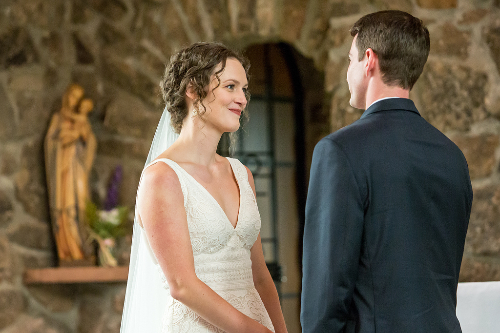 Erin smiles at Chip during wedding vows.