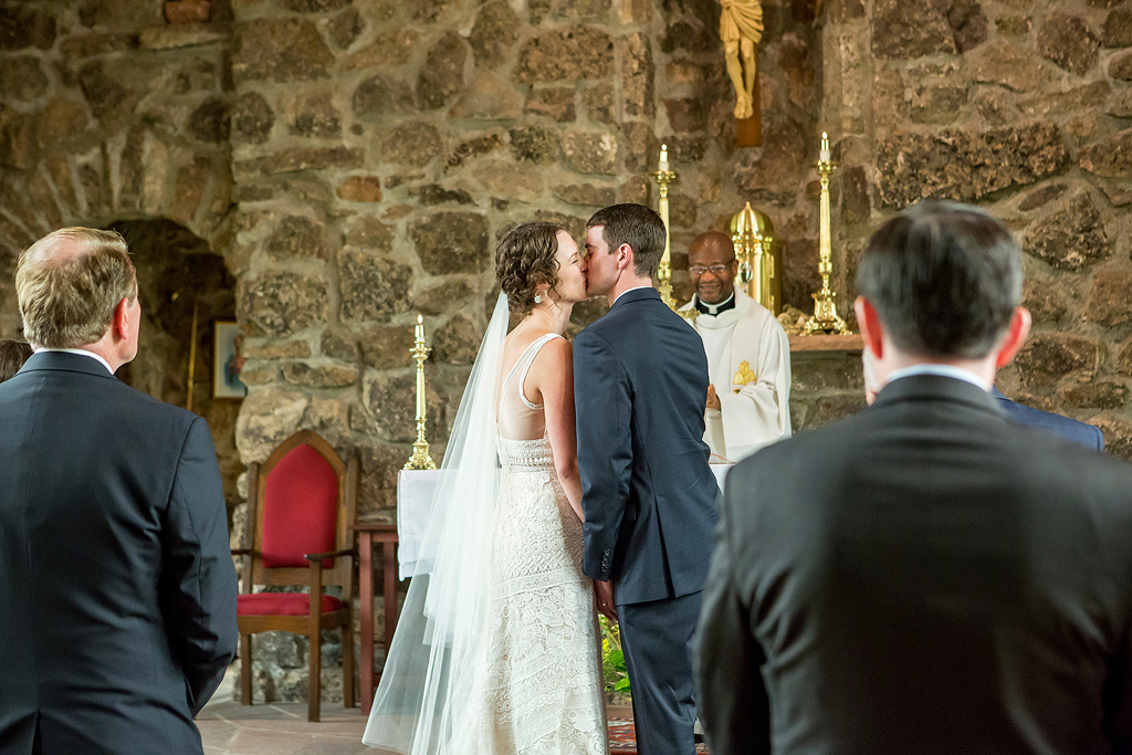 Couple kisses at the end of their wedding ceremony near Estes Park, Colorado.