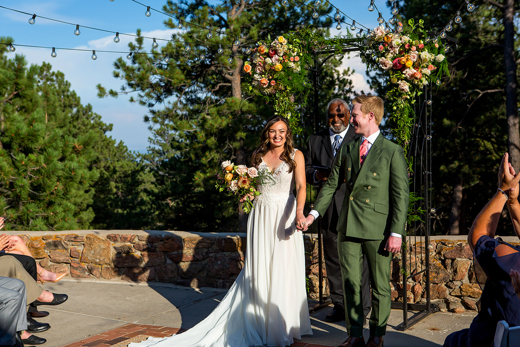 Jacob and Christine smile after they tie the knot at Boettcher Mansion.