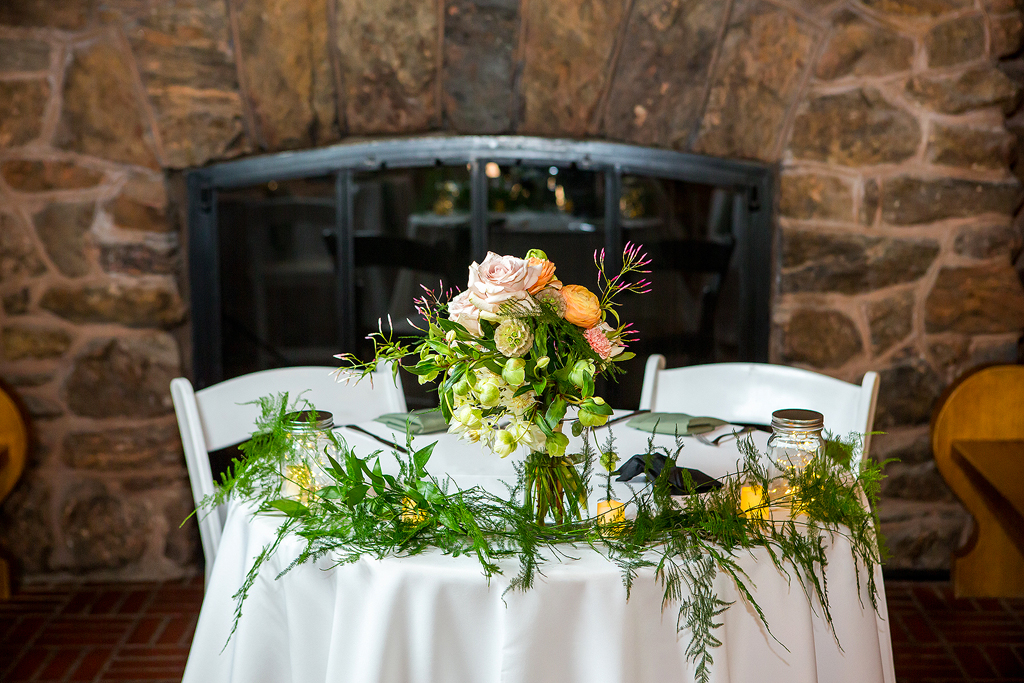 Boettcher Mansion wedding sweetheart table with white linens.