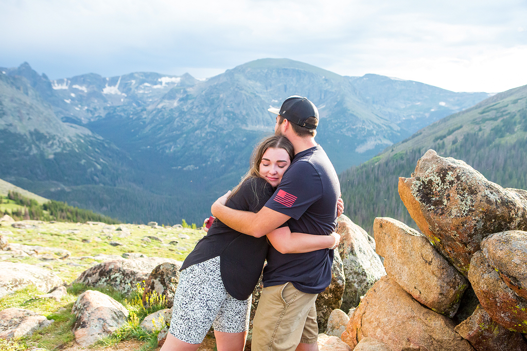 Couple hugs after their proposal on Trail Ridge Road in RMNP.