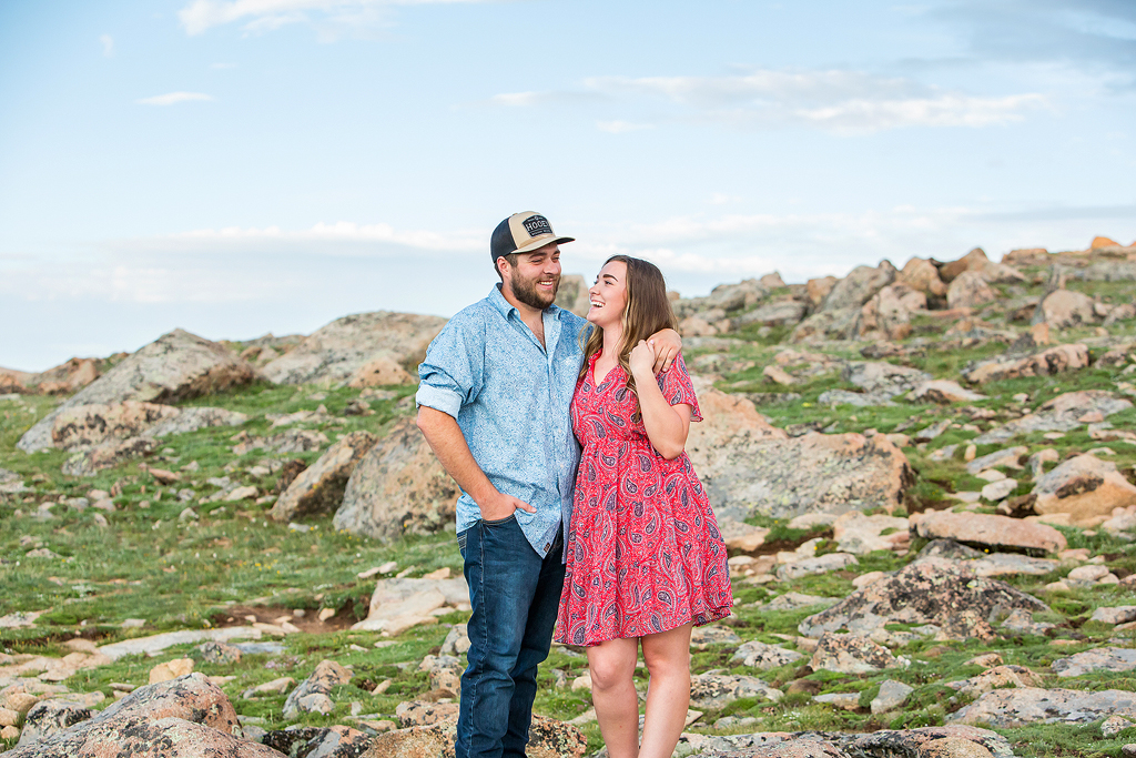Couple laughs in a Colorado alpine tundra in Rocky Mountain National Park.
