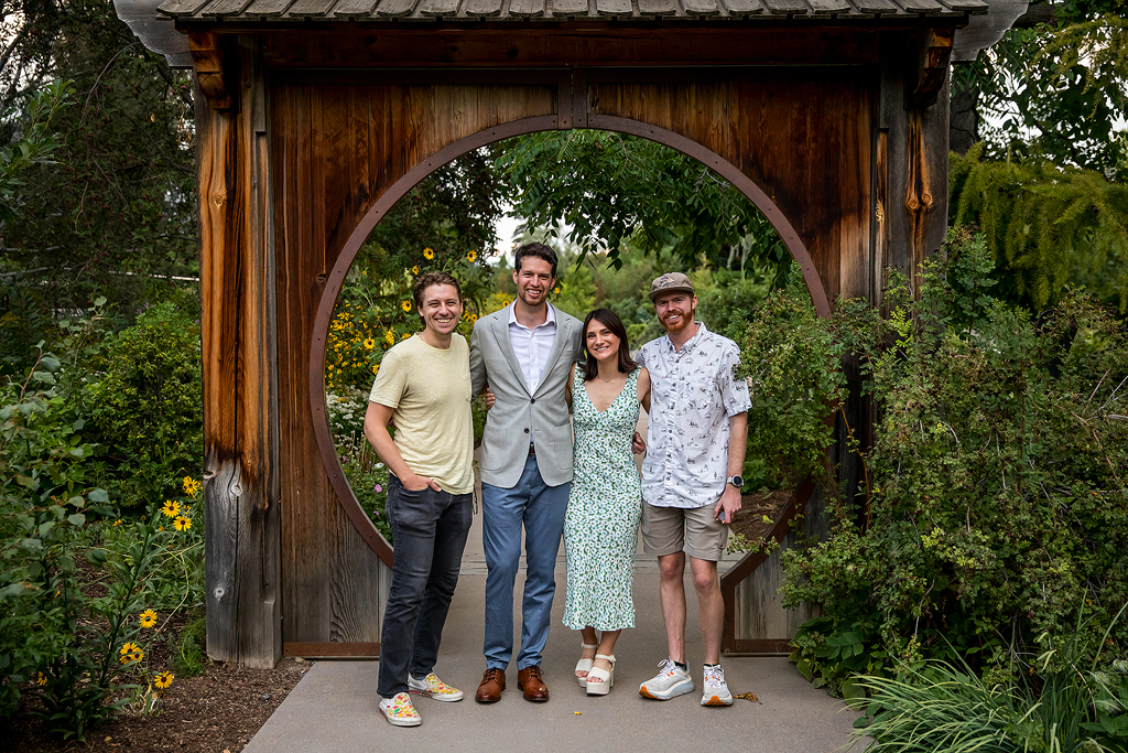 Couple with friends that helped them plan their Denver Botanic Gardens proposal.
