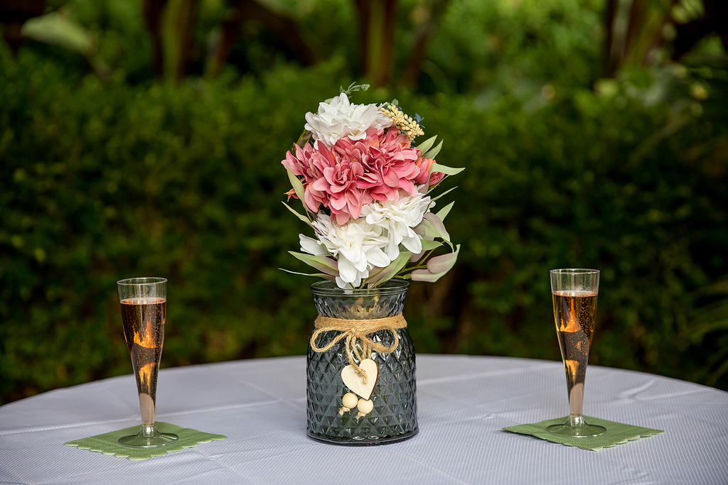 Close up of table with flowers and champagne.