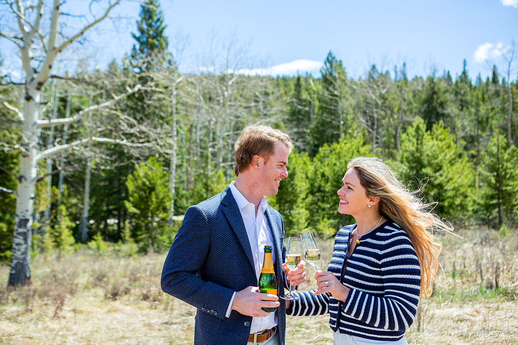Ed and Savannah toast during their Juniper Pass proposal story.