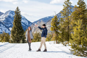 Dancing in the snow after getting engaged in Colorado.