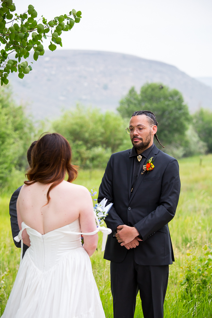 Groom's face during elopement ceremony in Gunnison, Colorado.