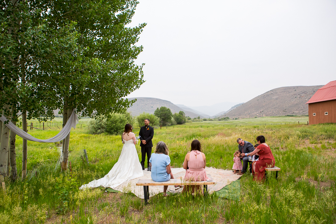 Elopement ceremony with a small family group at an airbnb in Gunnison, Colorado.