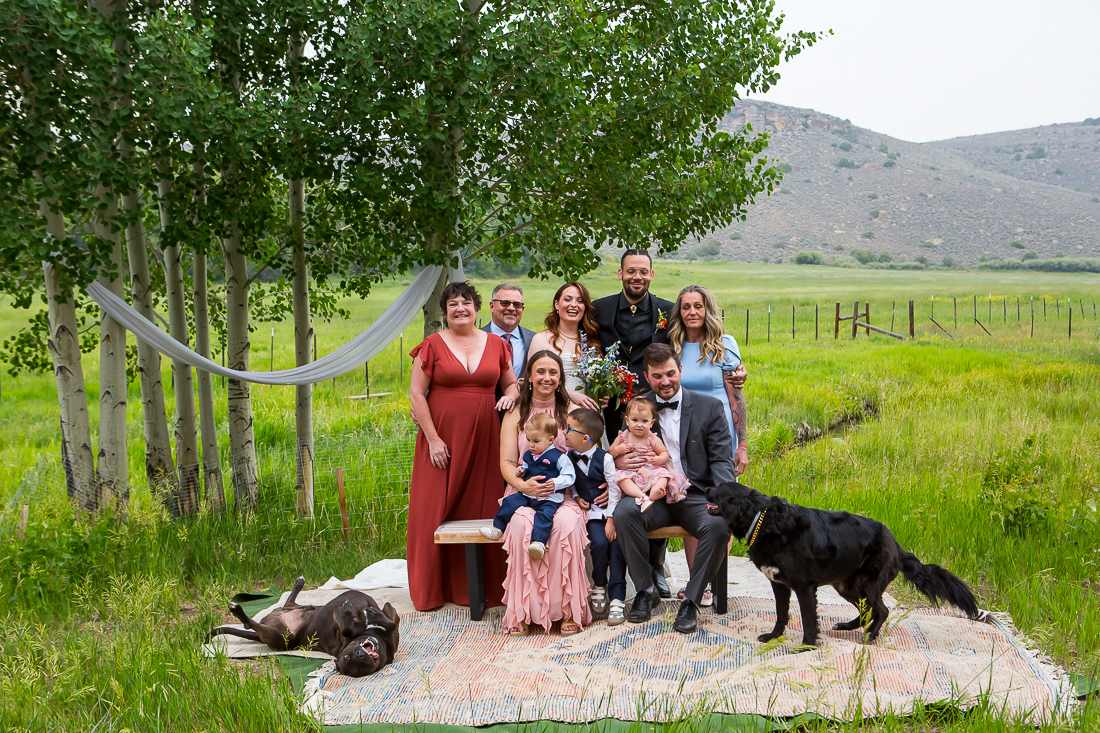 Gunnison elopement group photo with dogs being silly.