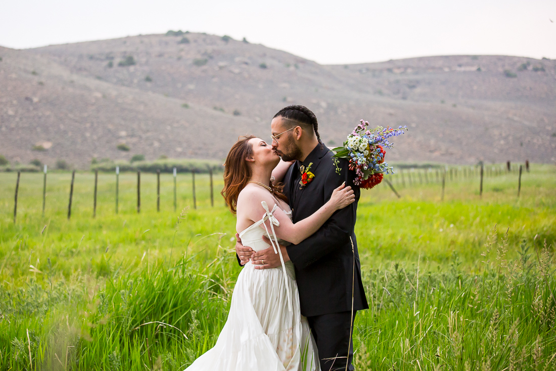 Bride and groom kiss at a Colorado airbnb elopement near Gunnison.
