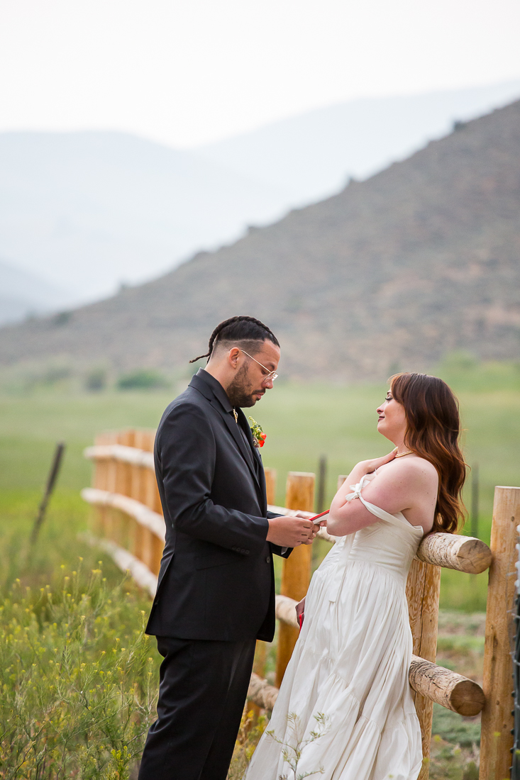 bride smiles during private vows at a ranch in Gunnison, Colorado.
